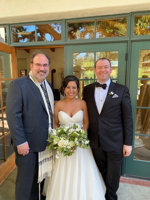 Rabbi Sandy with a newly married couple