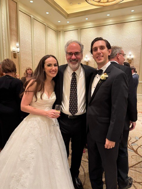 Rabbi Sandy celebrating with a wedding couple